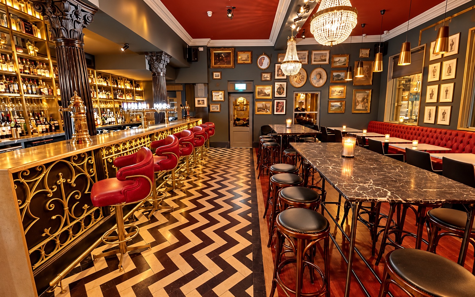The ornate bar, chandeliers and red seating at Doyle’s Corner
