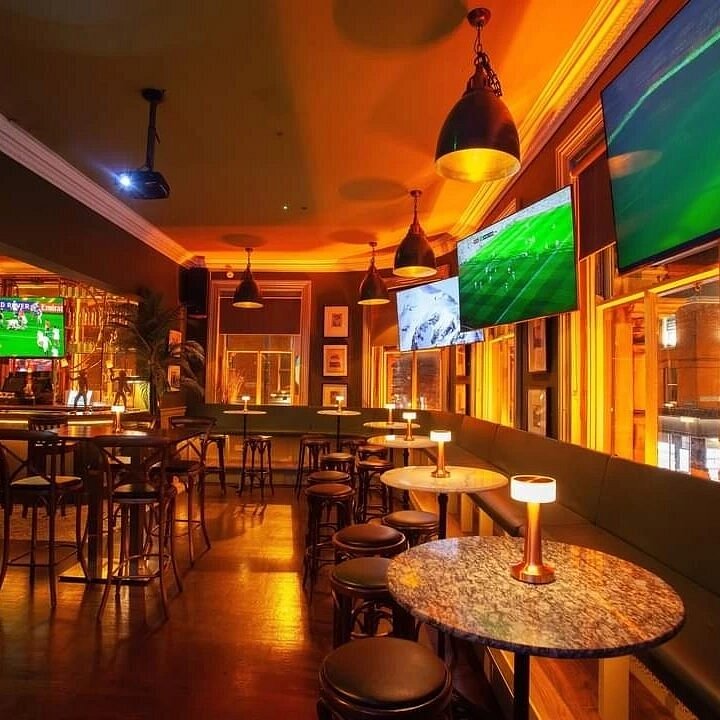 Television screens in Doyle’s Corner sports bar